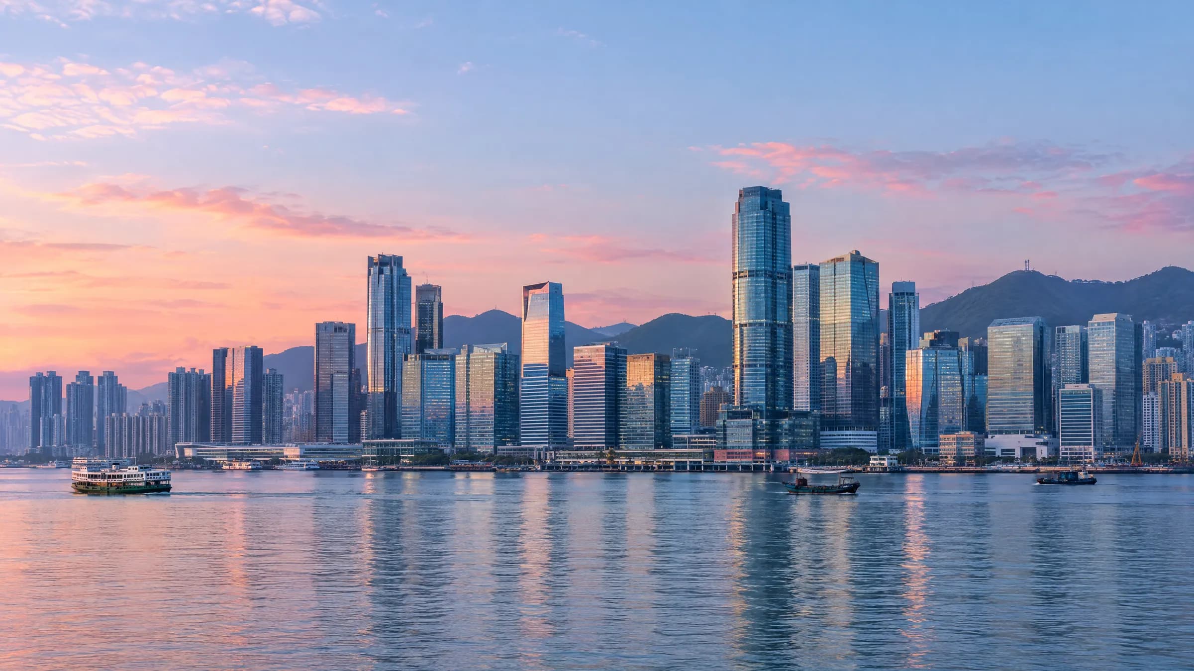 Office towers and Victoria Harbour at dawn